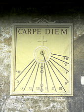A sundial inscribed with Carpe Diem, reminding us that every moment is precious and not to be taken advantage